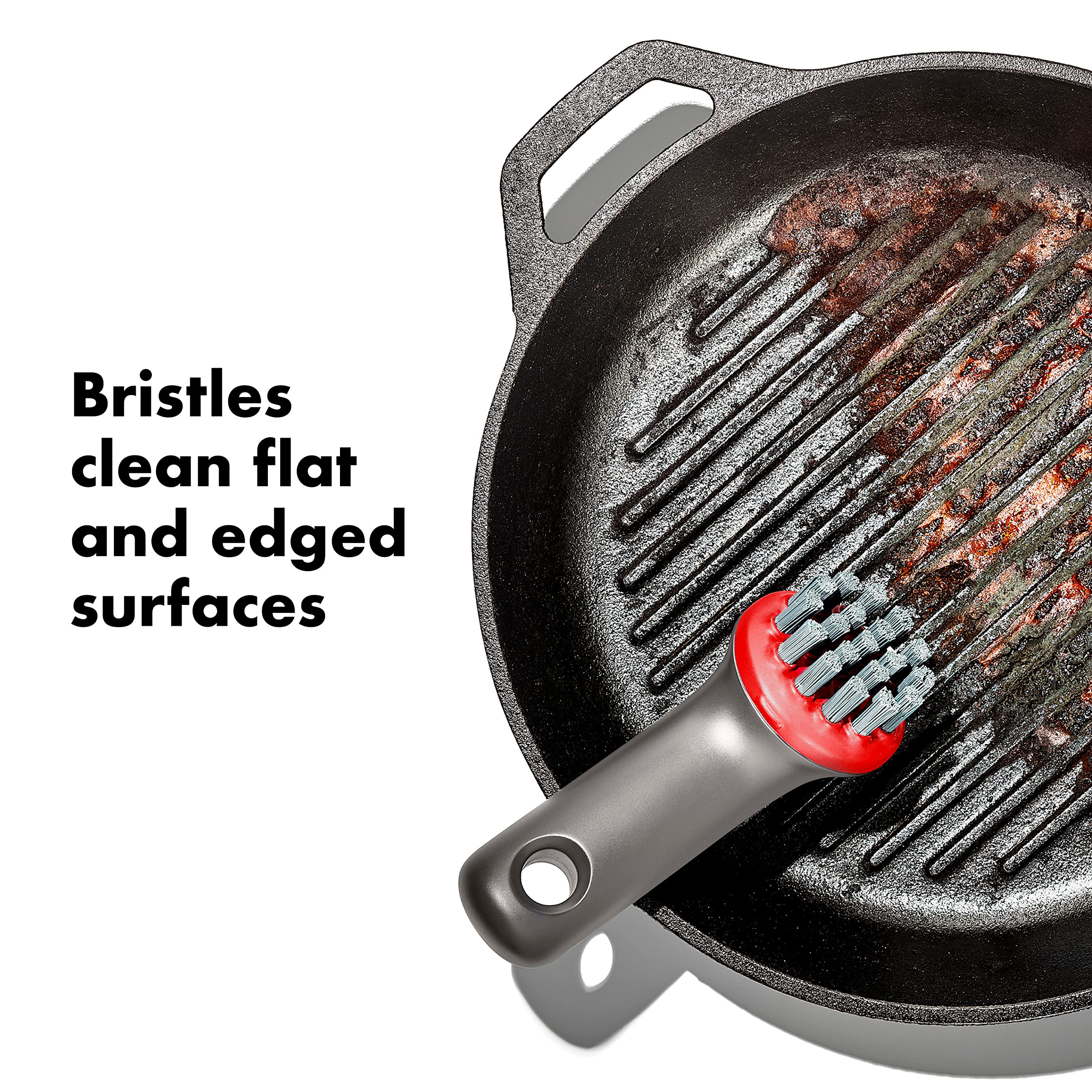 OXO Outdoor Heavy Duty Brush cleaning flat cookware surfaces.