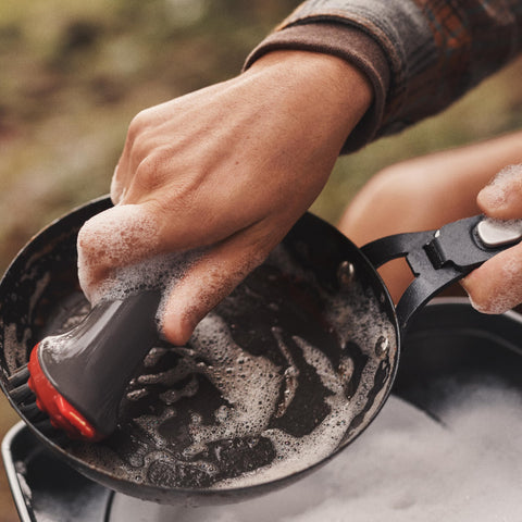 OXO Outdoor Heavy Duty Brush handle with non-slip grip for comfort.