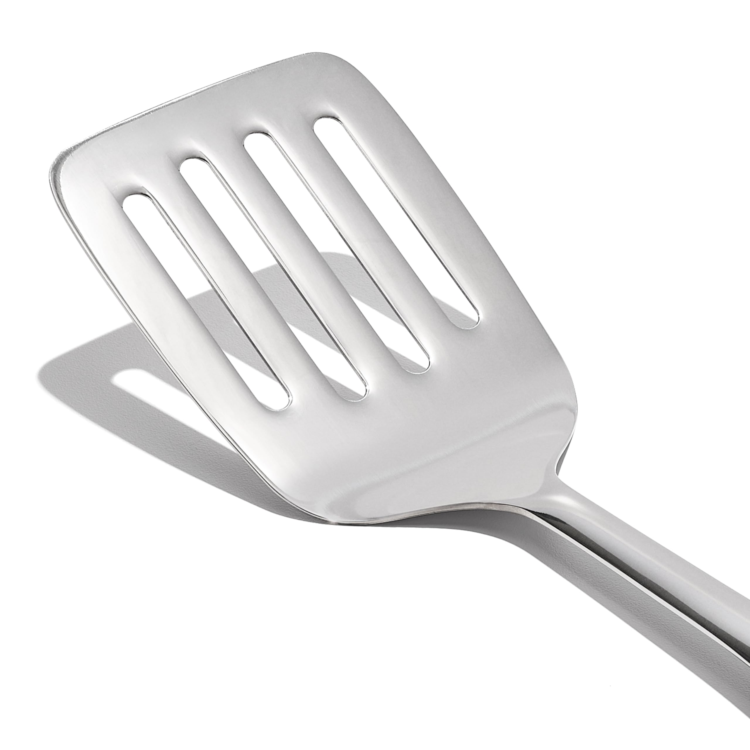 OXO Steel Cooking Turner flexible head under food for slide-under flipping.