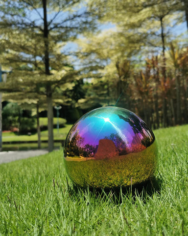 Pangmao mirror ball serves as a garden centerpiece with reflective shine.