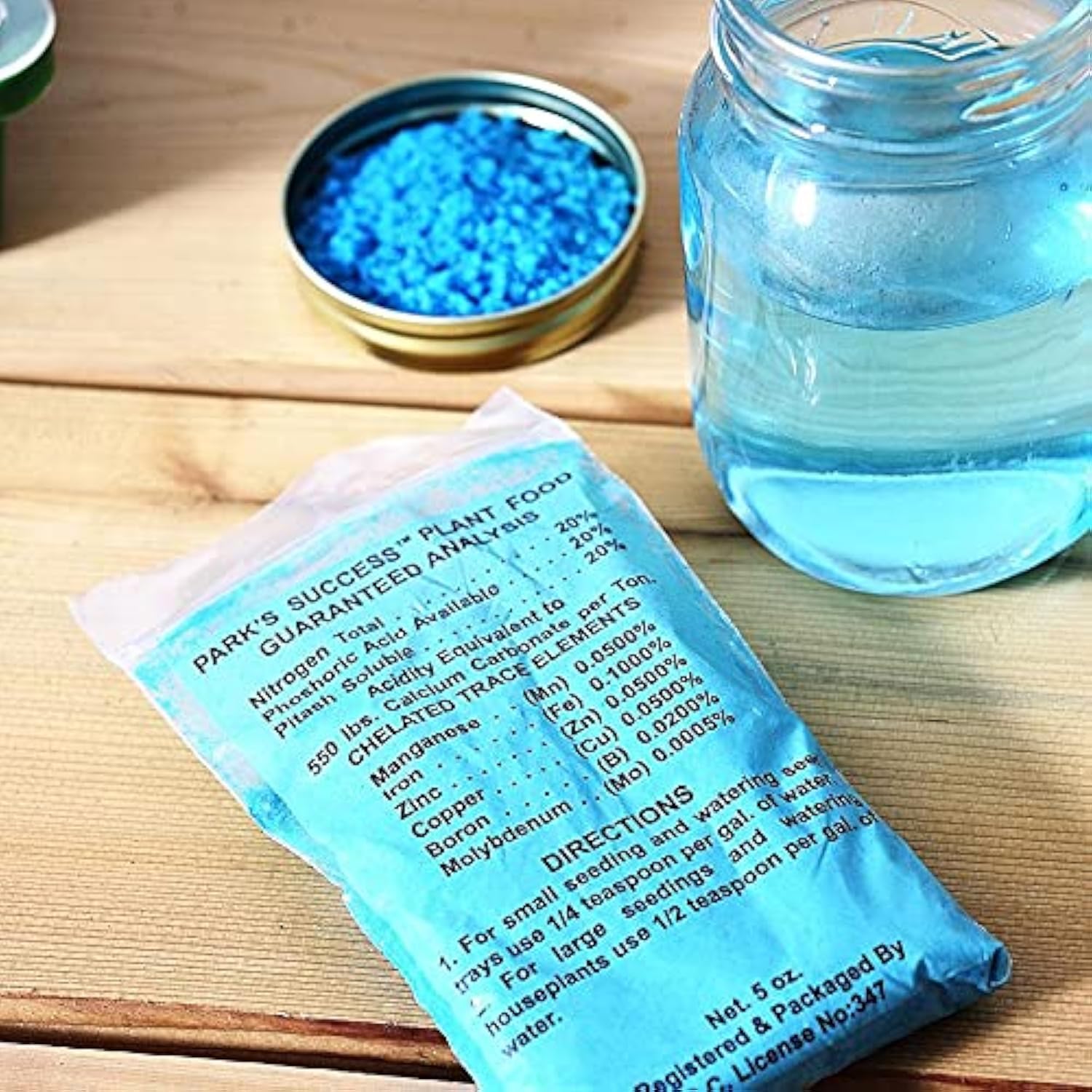 Park Seed Seedling Fertilizer blue crystals dissolving to feed seedlings
