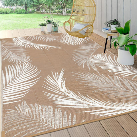 Pauwer leaf brown reversible outdoor rug on a patio, durable and weather-ready.