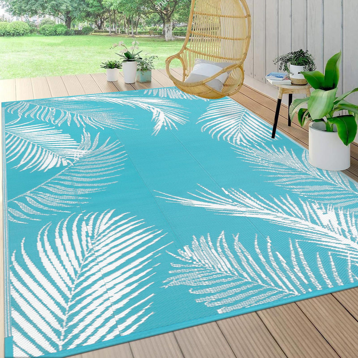 Pauwer Leaf Teal outdoor rug close-up showing durable waterproof polypropylene for easy maintenance
