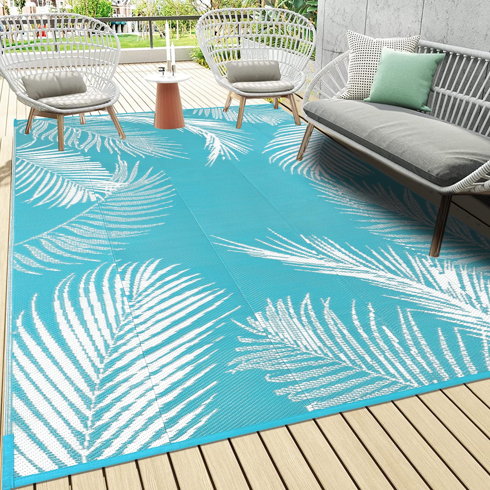 Pauwer leaf teal outdoor rug with leaf pattern for patio