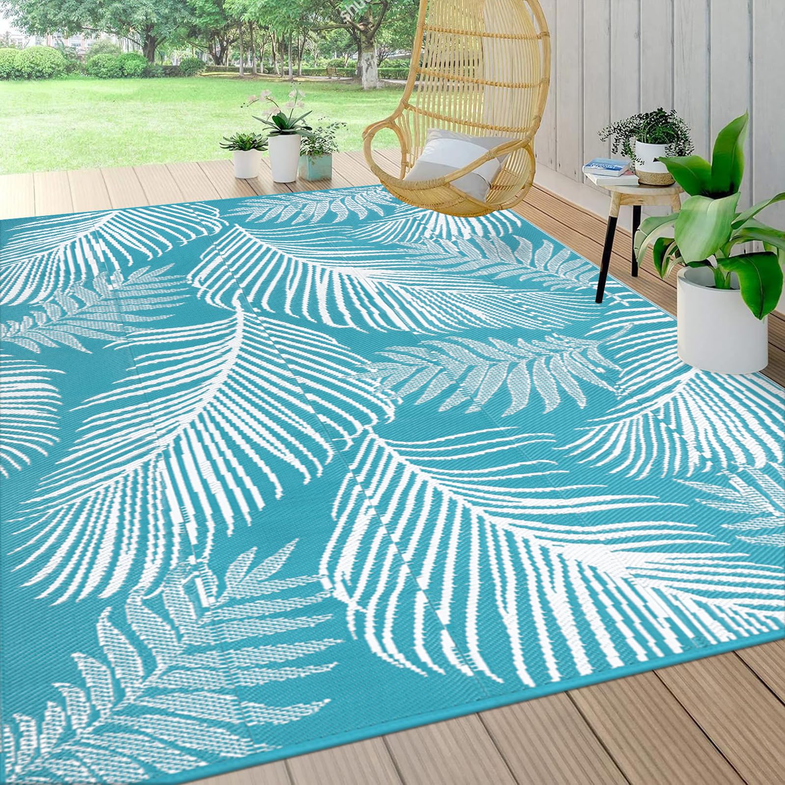 Pauwer leaf teal reversible outdoor rug offers dual sides for versatile deck styling.