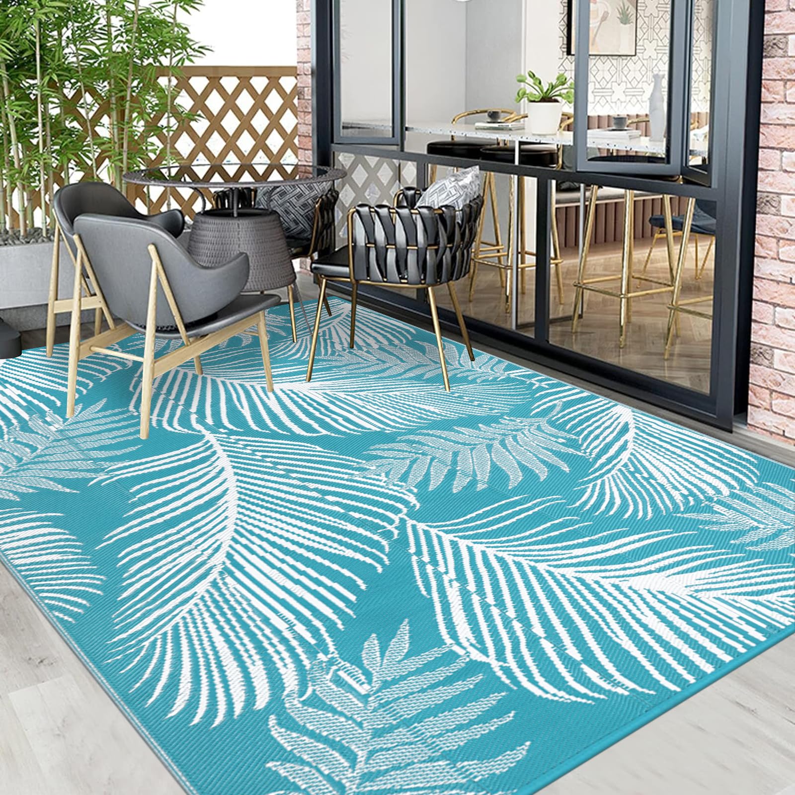 Pauwer lightweight portable rug with stakes for secure placement.
