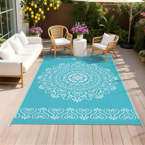 Pauwer outdoor rug 5x8 with floral teal pattern, reversible for two looks.