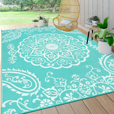 Pauwer 8x10 reversible rug with front floral pattern, durable for outdoor use.