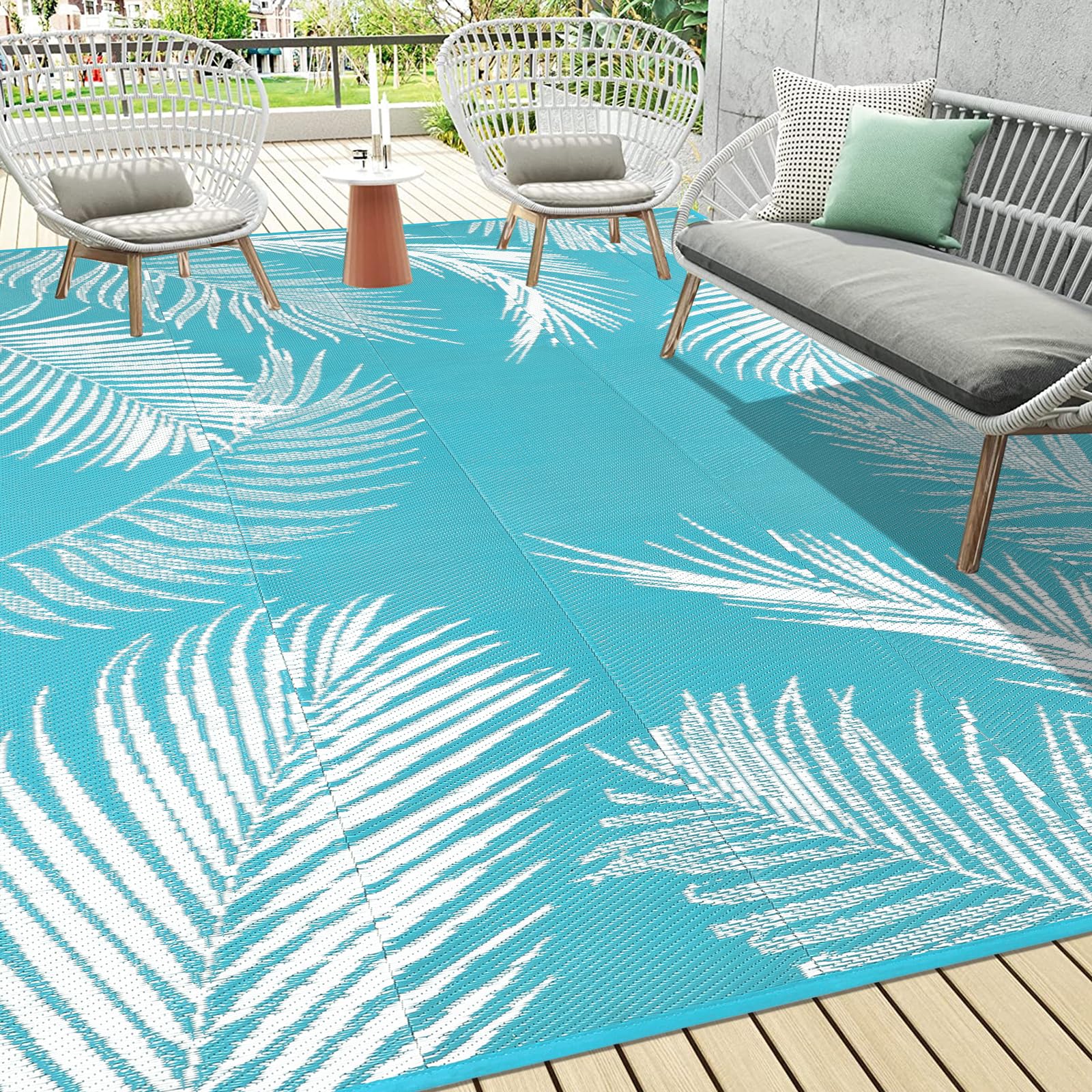 Pauwer outdoor rug leaf teal top view highlighting durable waterproof surface