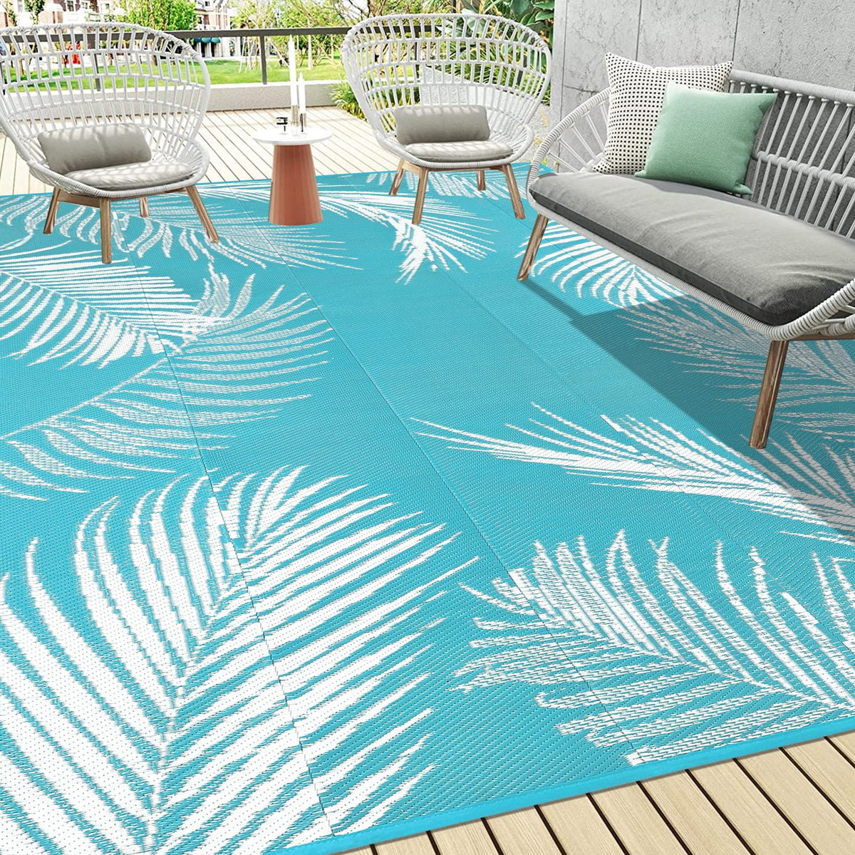Pauwer outdoor rug leaf teal top view highlighting durable waterproof surface