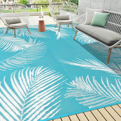 Pauwer outdoor rug leaf teal top view highlighting durable waterproof surface