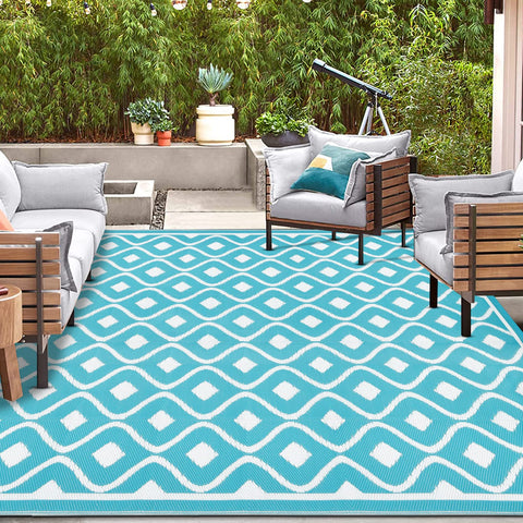 Pauwer outdoor mat used on deck, patio, or beach for versatile living spaces.