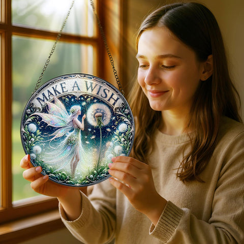 Pauyadu fairy suncatcher highlights colorful glass in a living room display.
