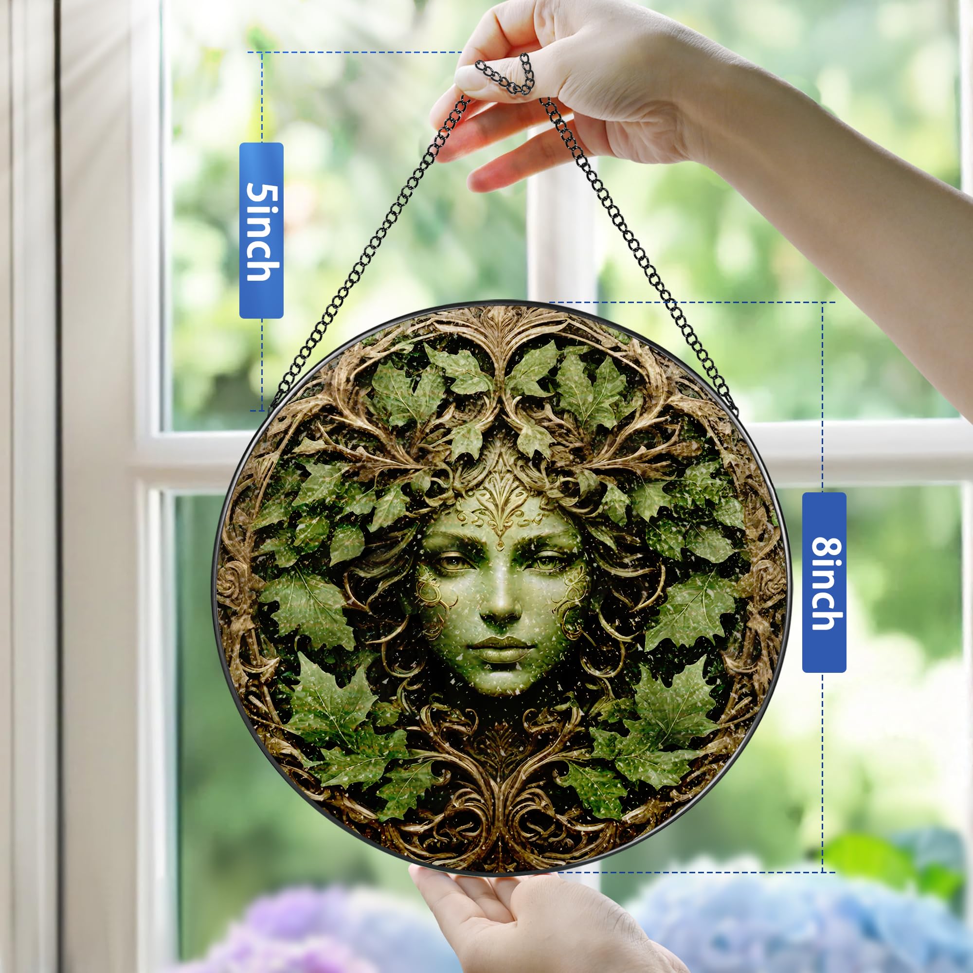 Pauyadu sunlit glass ornament reflecting rainbow hues in garden window