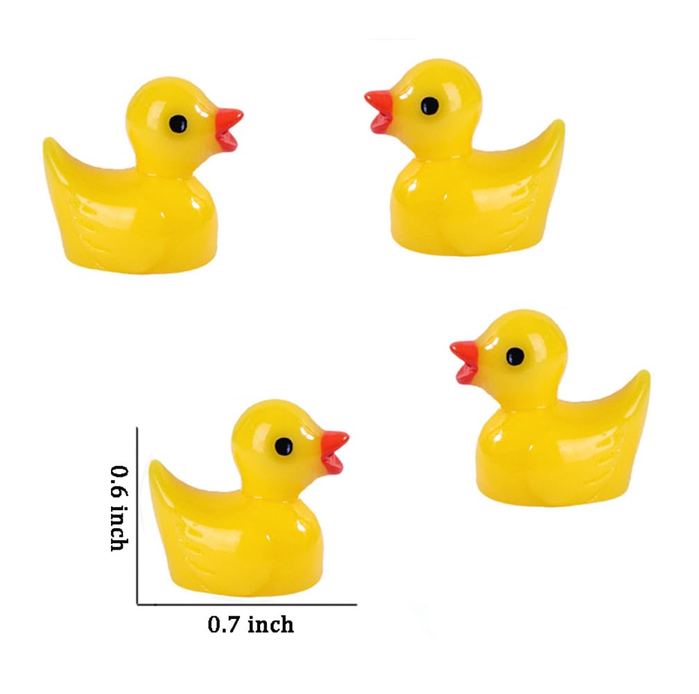 Pcxino yellow resin ducks brighten a garden pond scene