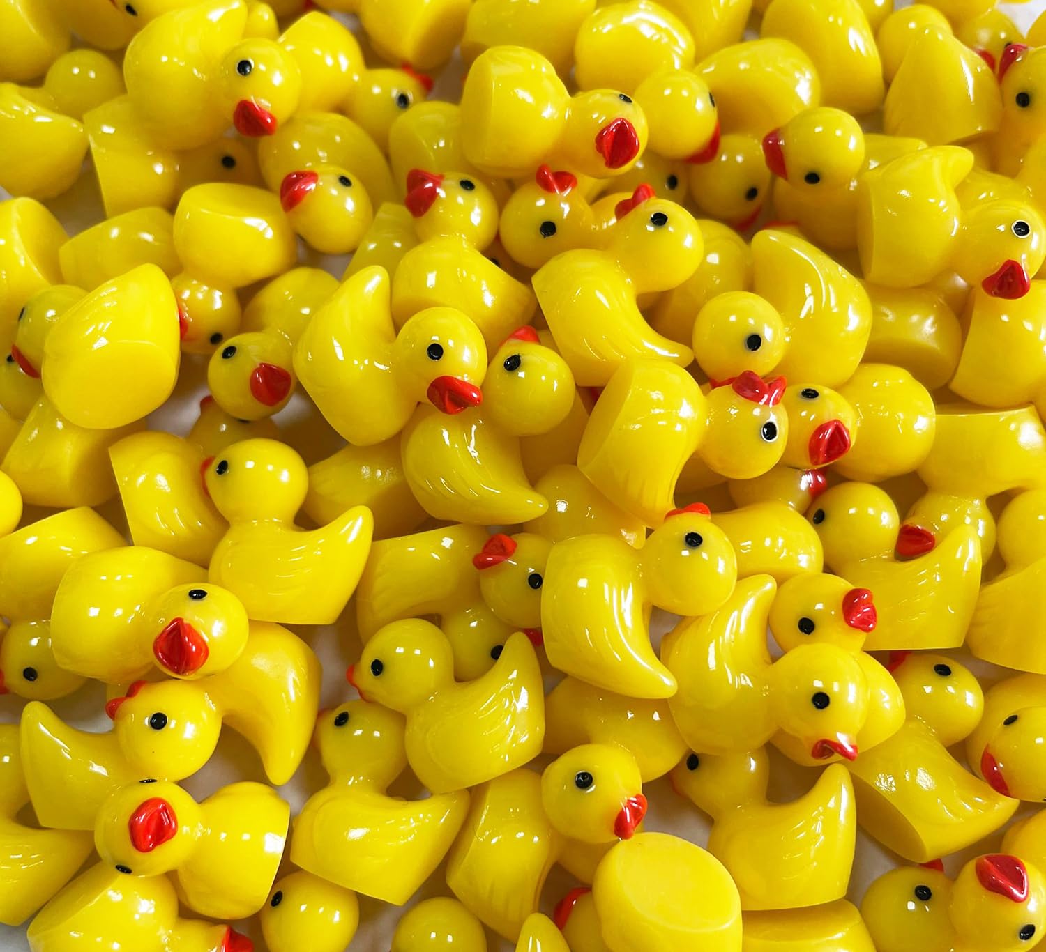 Pcxino tiny yellow ducks used as plant pot accents