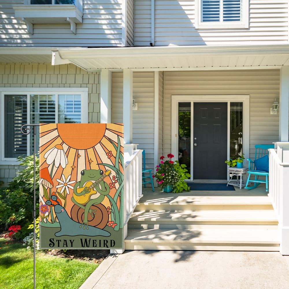 Perfectinsoy Stay Weird flag on porch and lawn welcomes guests.