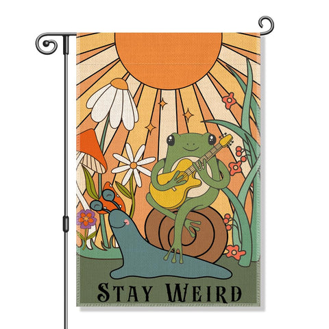 Perfectinsoy Stay Weird flag with snail and frog design adds whimsy to garden.