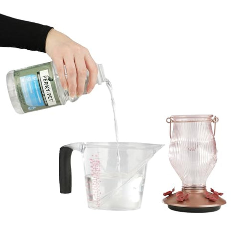 Perky-Pet nectar concentrate label highlighting 100% sucrose energy source for hummingbirds