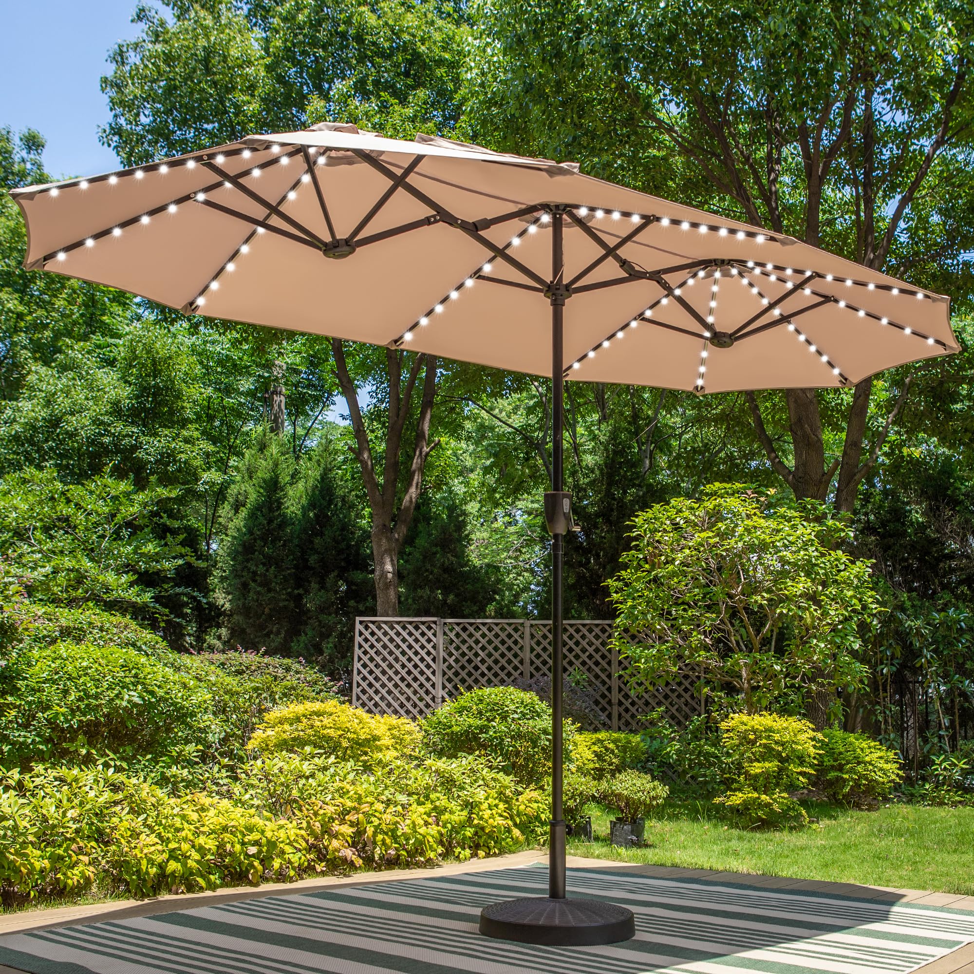 PHI VILLA 13ft triple-head beige umbrella shading a large outdoor dining area.
