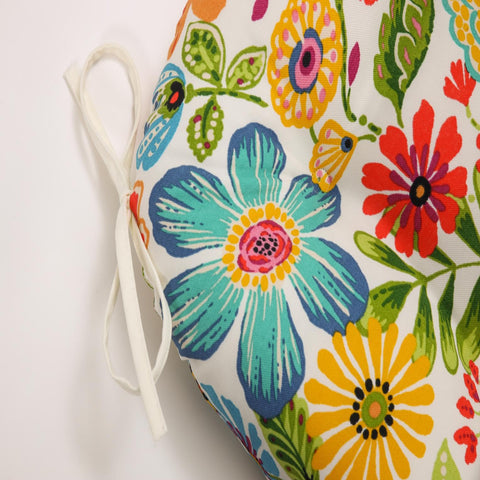 Pillow Perfect Gregoire outdoor-use cushions in a sunny patio scene.