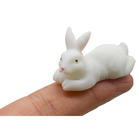 Pinenjoy rabbit figurine with cheerful face suitable as a cake topper.