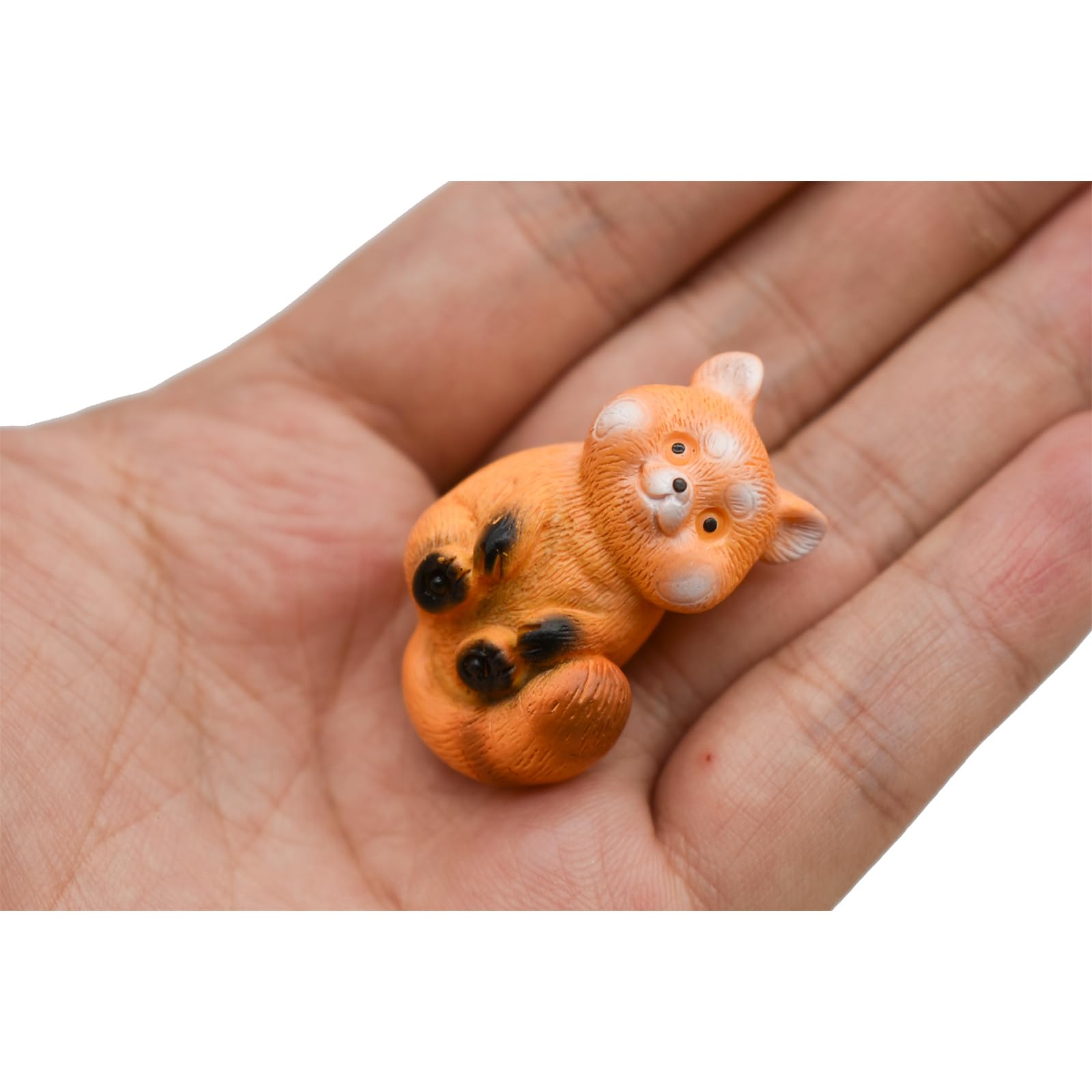 Pinenjoy red panda tongue-out figurine for playful decor.