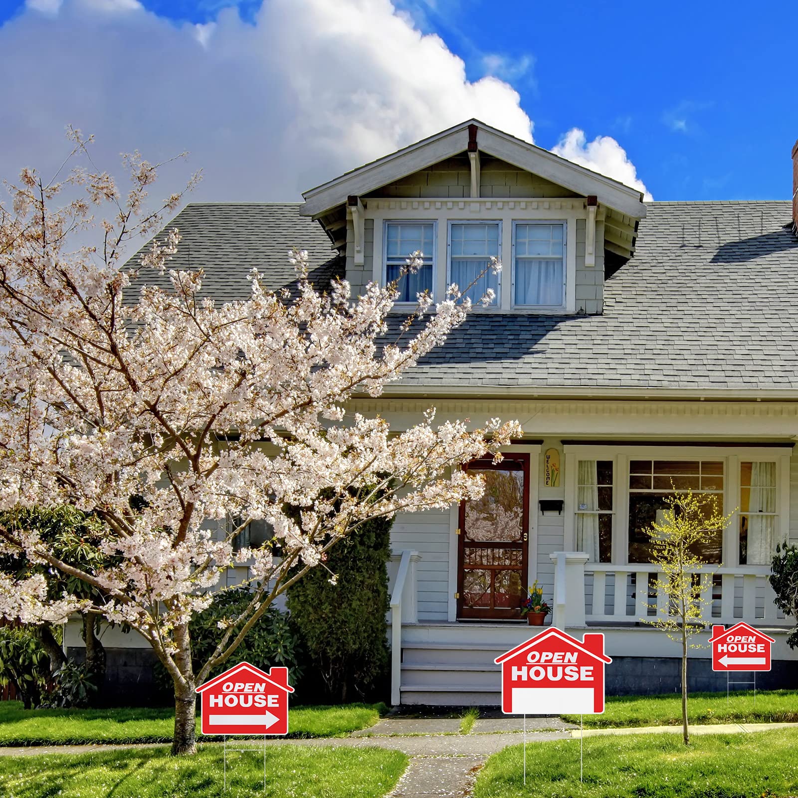 Pinkunn real estate signage in use on a residential lawn.