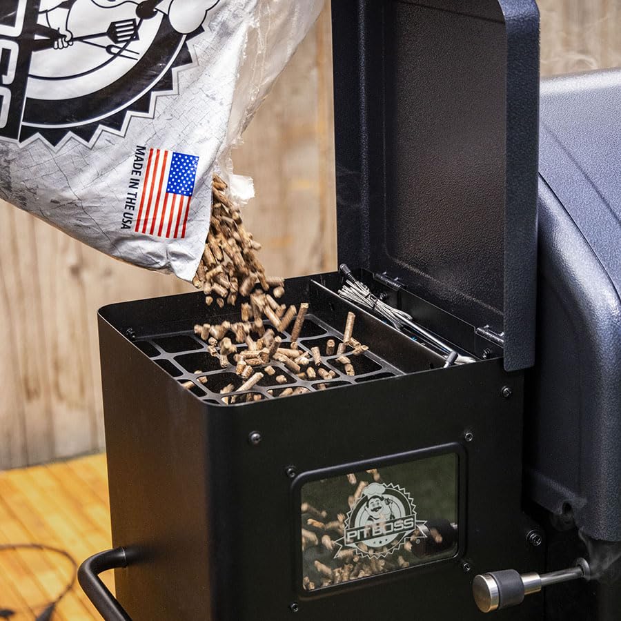 Pit Boss Apple Pellets being poured into a grill hopper.
