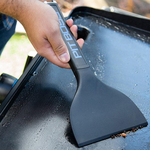 Pit Boss Ultimate griddle scraper for quick grease and debris removal