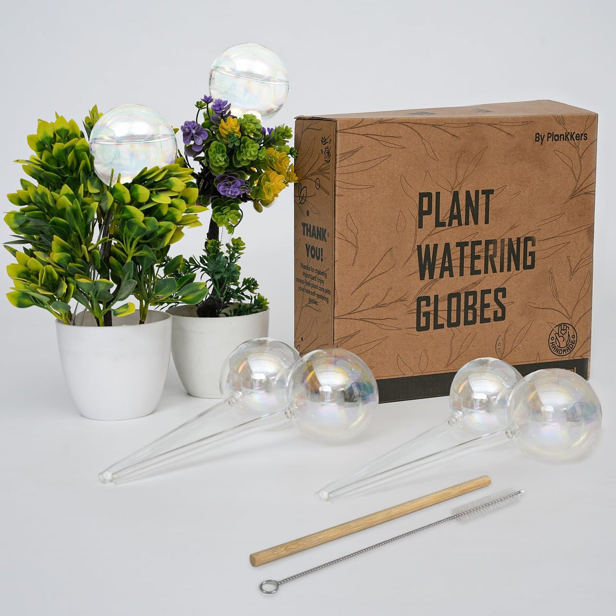 PlanKKers iridescent watering globes provide gentle indoor hydration for plants