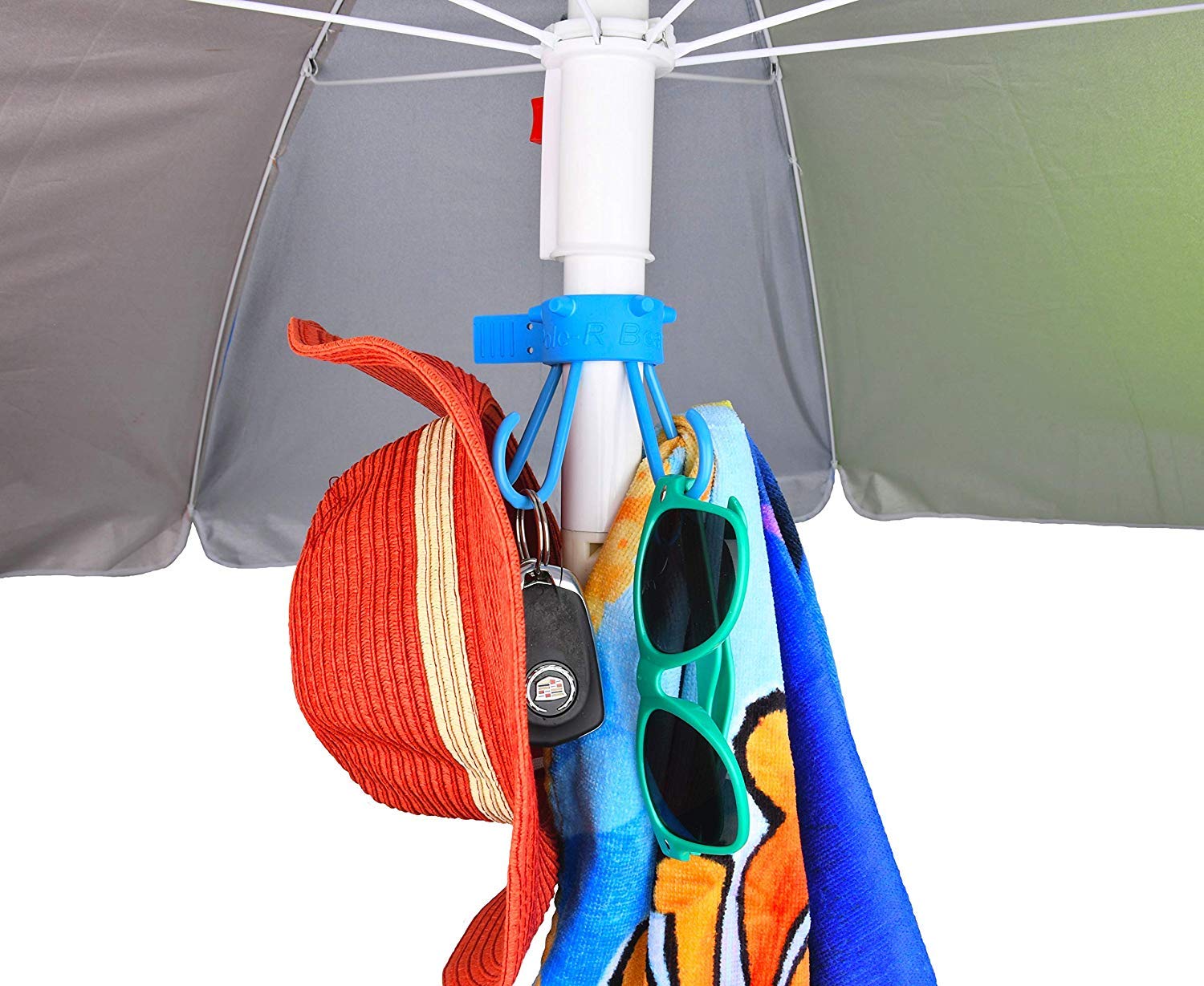 Pole-R Bear umbrella hook secures bags, reducing clutter at the beach.