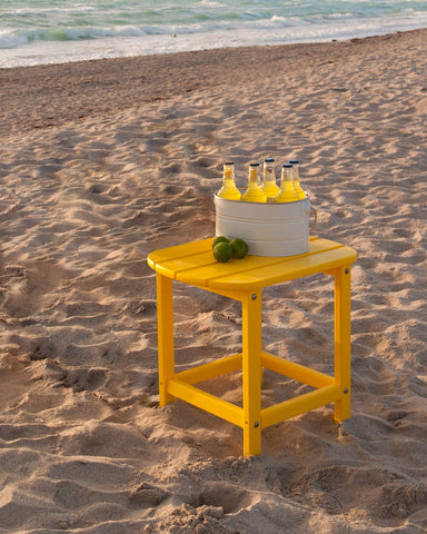 POLYWOOD outdoor side table offers durable maintenance-free support beside the South Beach chairs.