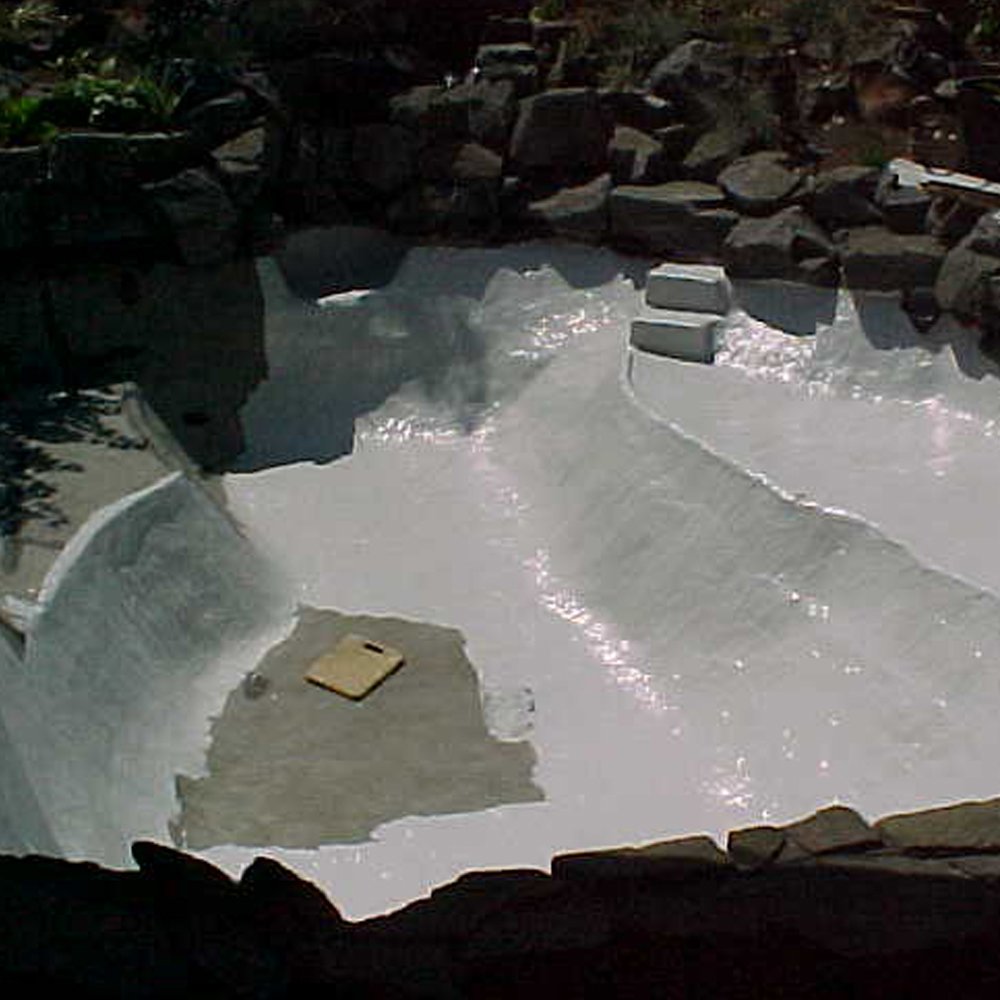 Pond Shield gray epoxy paint being applied with brush for even coverage