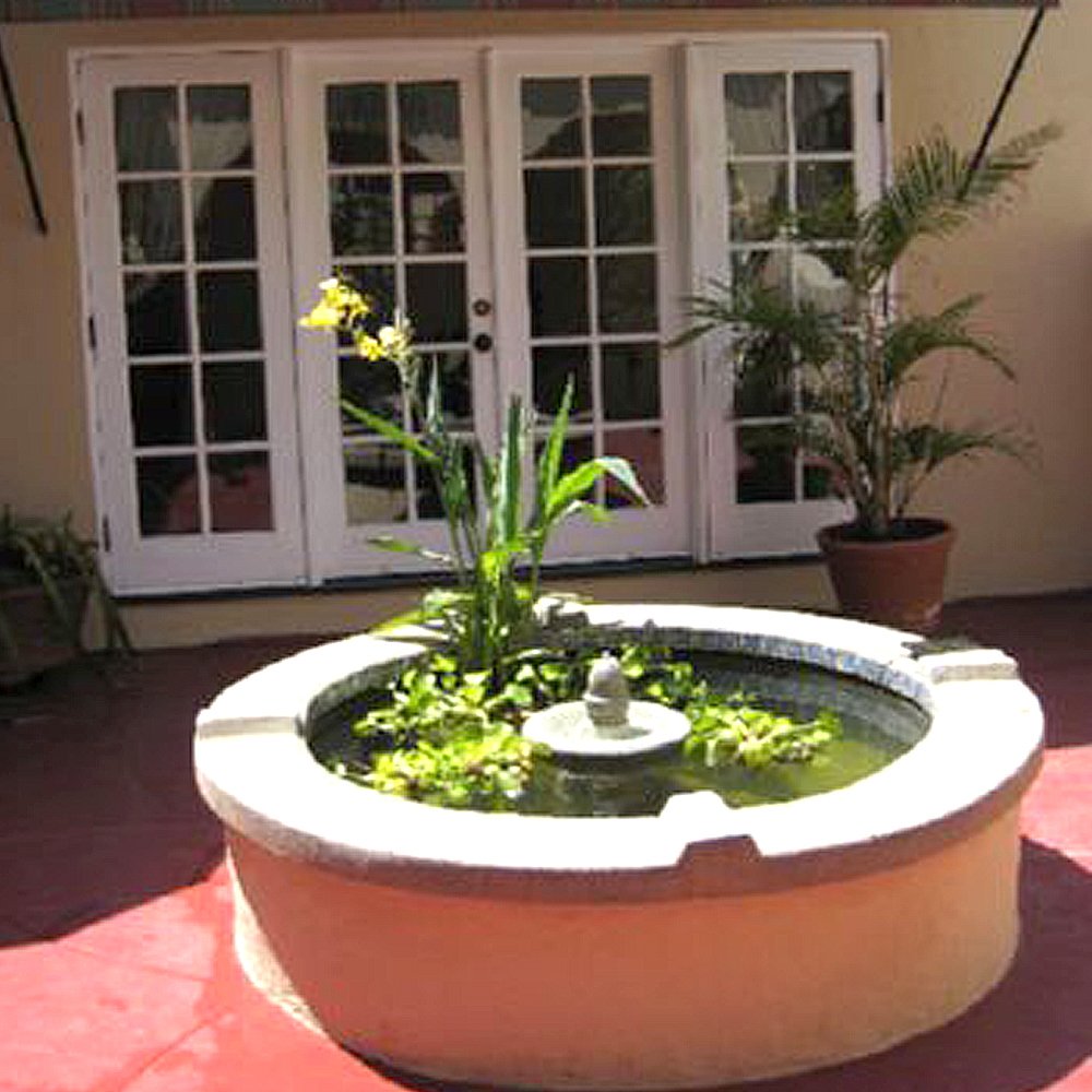 Pond Shield gray epoxy coating on pond surface ready for water features