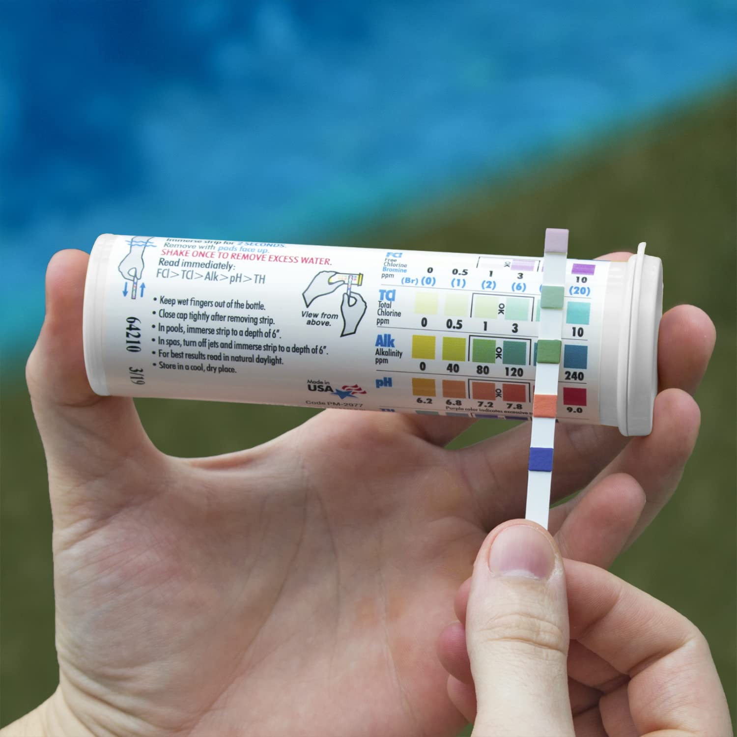Poolmaster 22212 strips close-up showing easy readings for chlorine and pH.