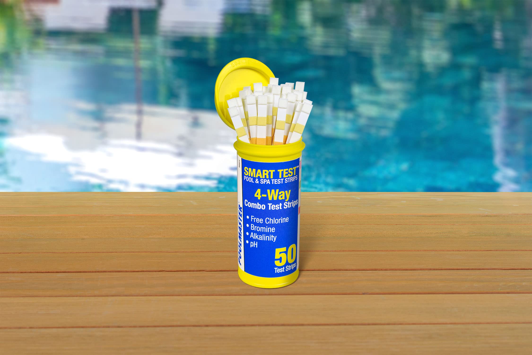 Poolmaster strip dipping into pool water for quick readings.