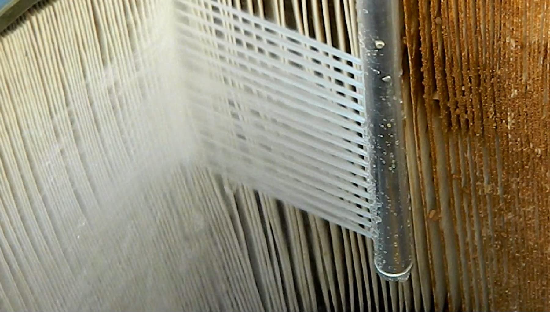 Power Pic Reach attached to a garden hose shows efficient cleaning with reduced splash back.