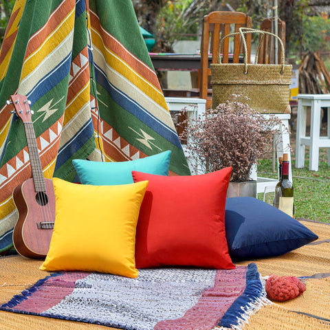 Premillow patio decor setup with yellow cushion enhances outdoor seating.