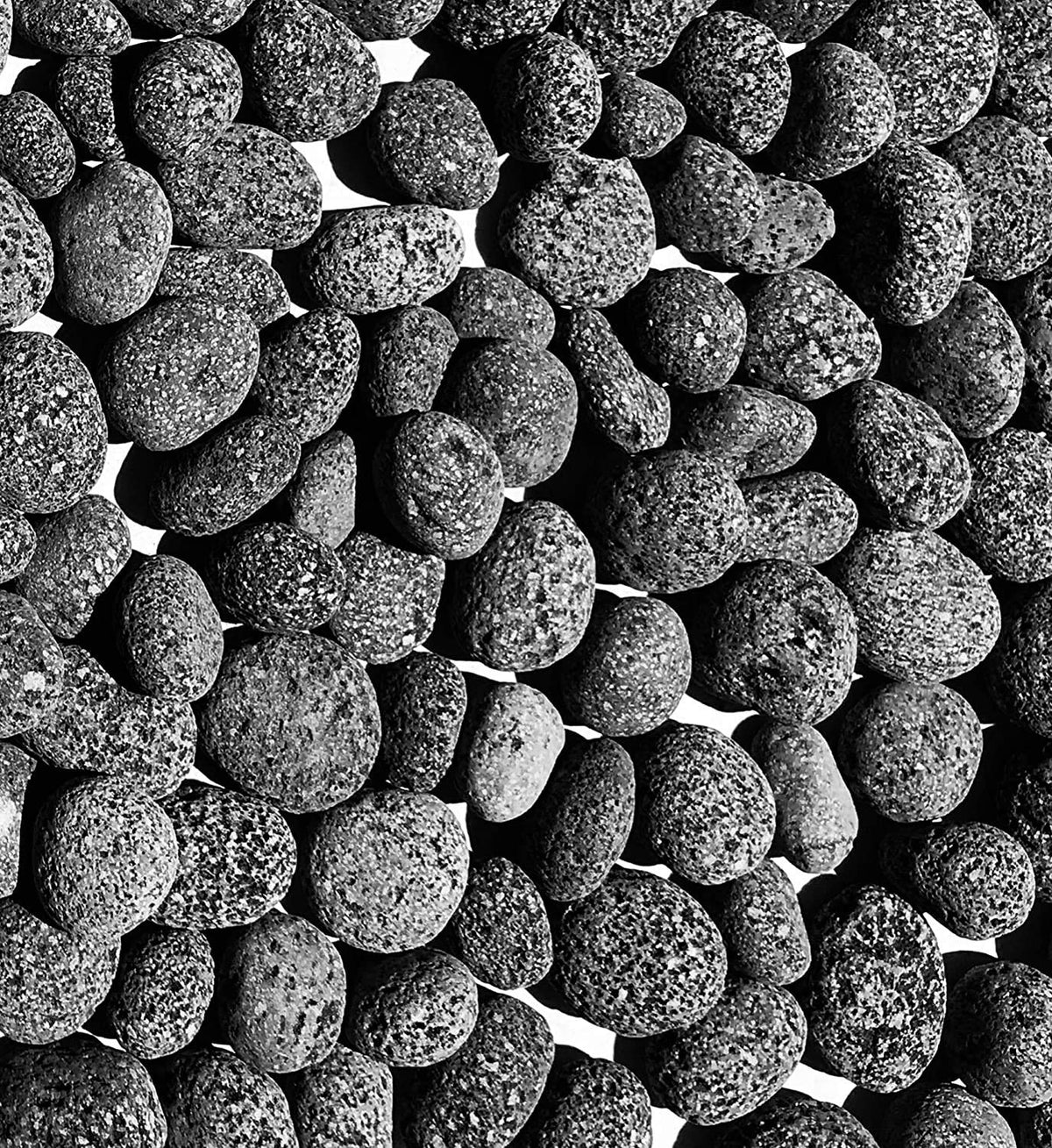 Premium Pebbles black lava rocks for fire pits, 2–3 inch size, dramatic ambiance.