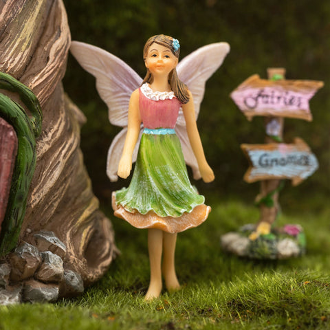 PRETMANNS Outdoor Fairy Garden Display integrates with plants and stones.