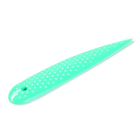 Curved end of Prym Love Point Turner creasing seams without heat for clean lines.