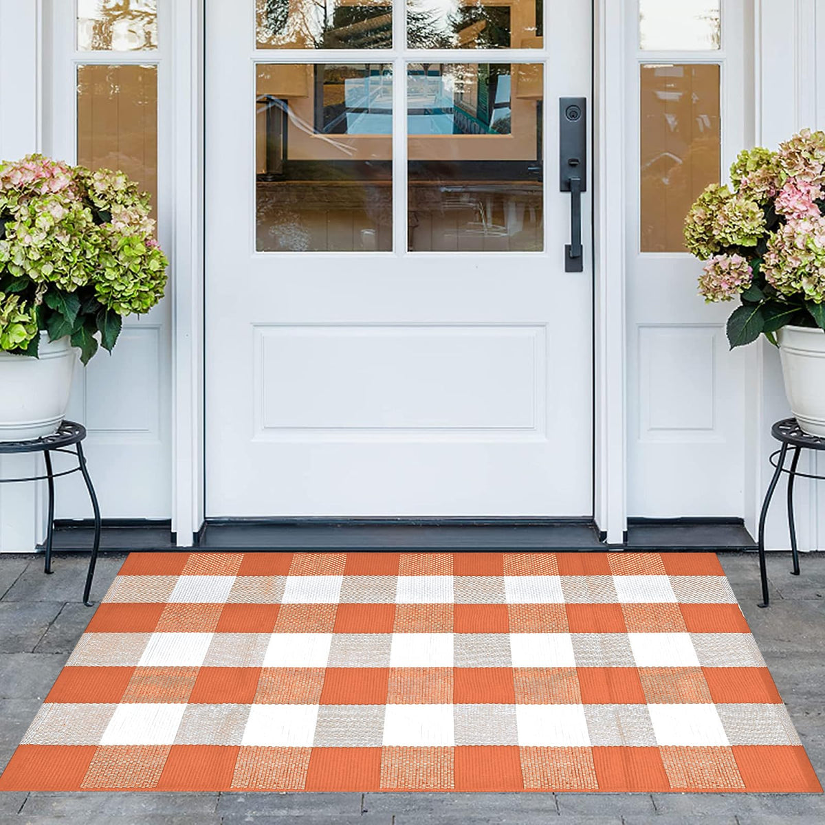 Pseutio Buffalo Plaid Rug on front porch adds warm curb appeal and easy cleaning.