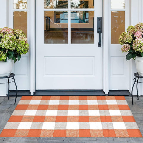 Pseutio Buffalo Plaid Rug on front porch adds warm curb appeal and easy cleaning.