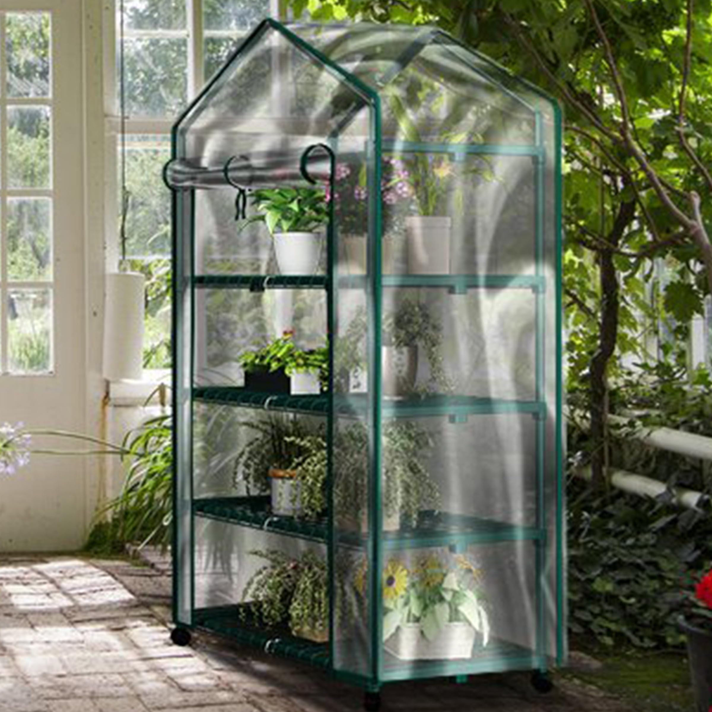 Pure Garden greenhouse on locking wheels for easy movement