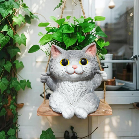 Pyoimmne cat hanging planter with adorable design, ideal for small succulents.