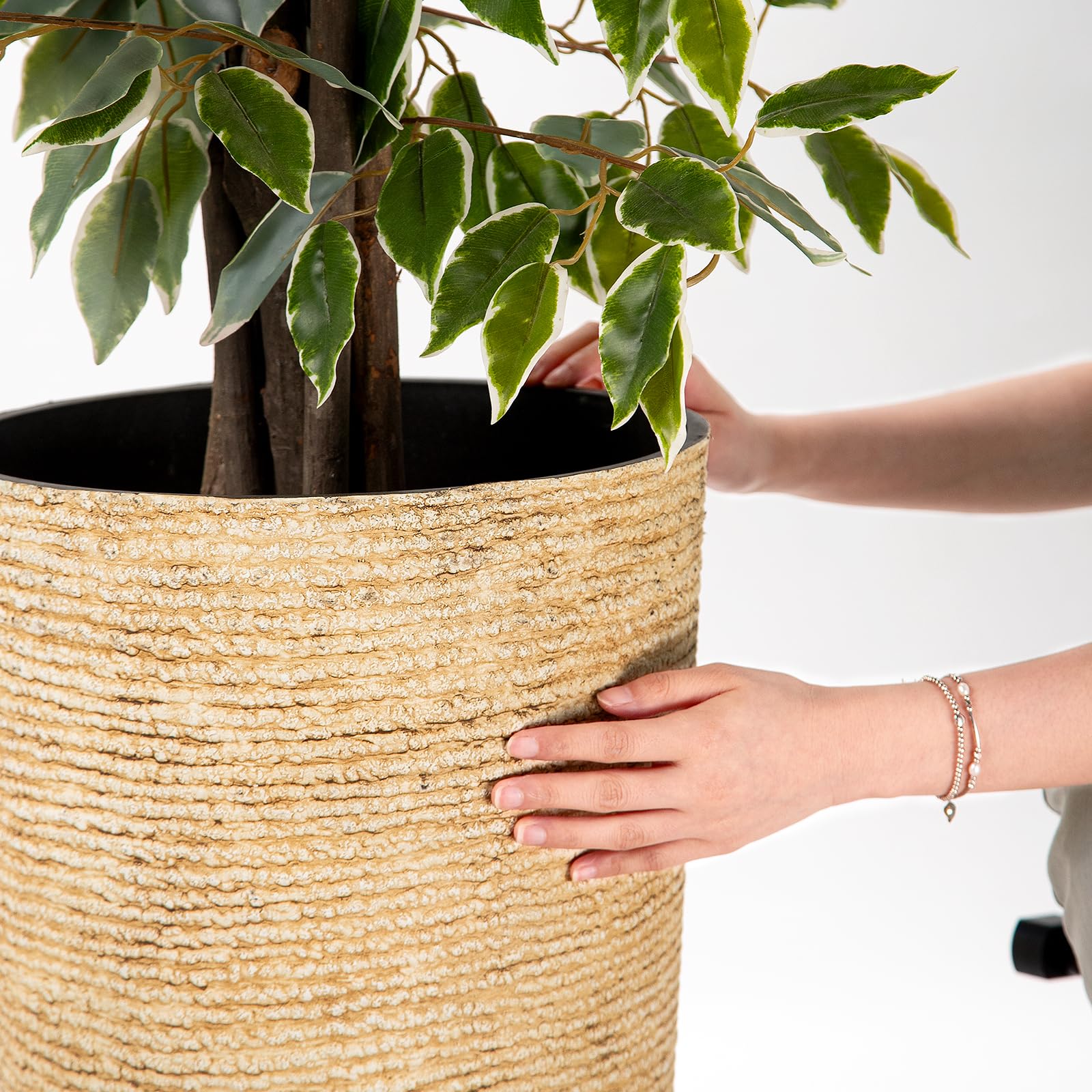 QCQHDU planter with drainage holes helps prevent overwatering.