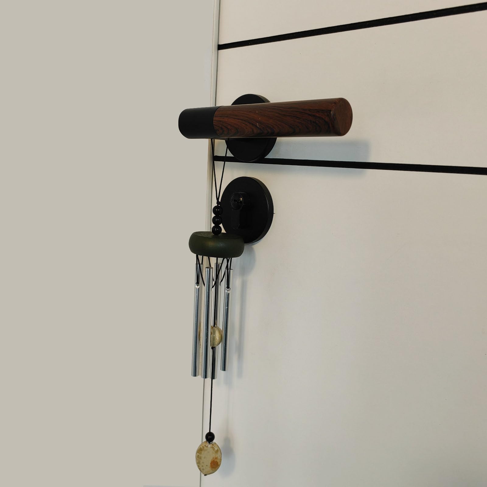 QIPAN wind chimes featuring a wind catcher enhance porch aesthetics and resonance.