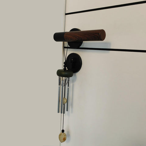 QIPAN wind chimes featuring a wind catcher enhance porch aesthetics and resonance.