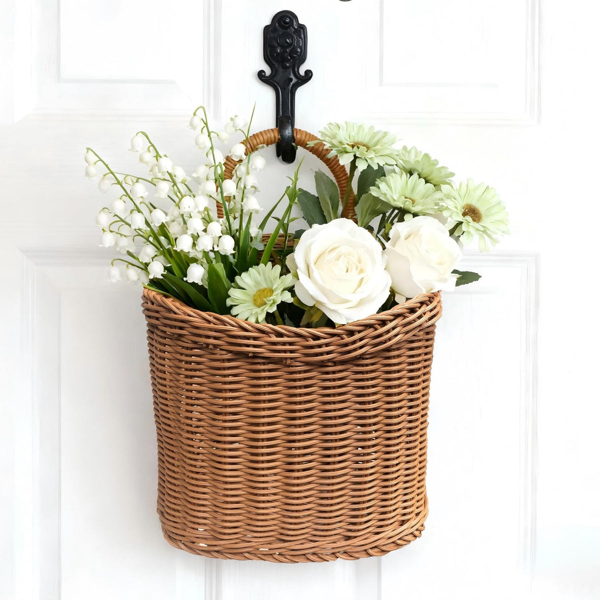 Quincry woven hanging basket on front door adds rustic curb appeal.